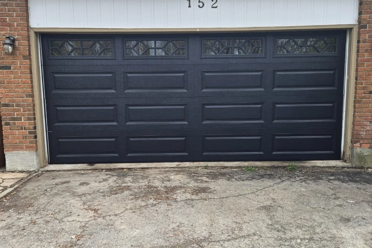 Modern commercial building with a charcoal sectional garage door